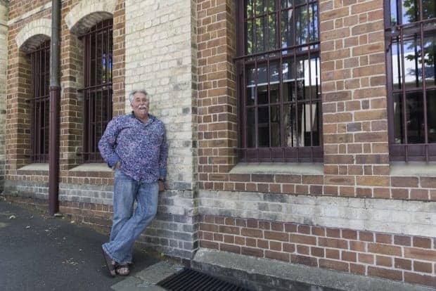 Picture of Micheal Krivohlavy leaning against a wall